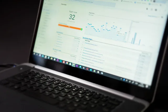 A laptop displaying an analytics dashboard with real-time data tracking and analysis tools. B2B influencer marketing measurement mistakes: a pre-report audit